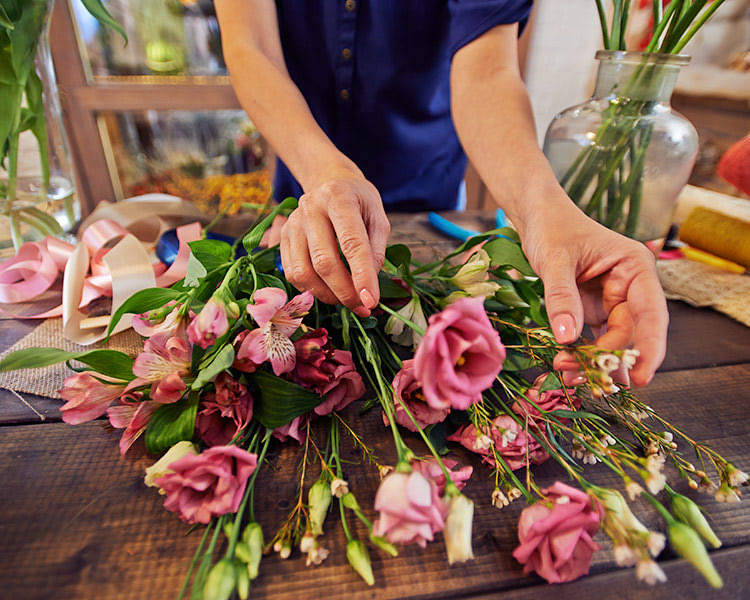 The skilled hands of a local floral designer ply their trade
